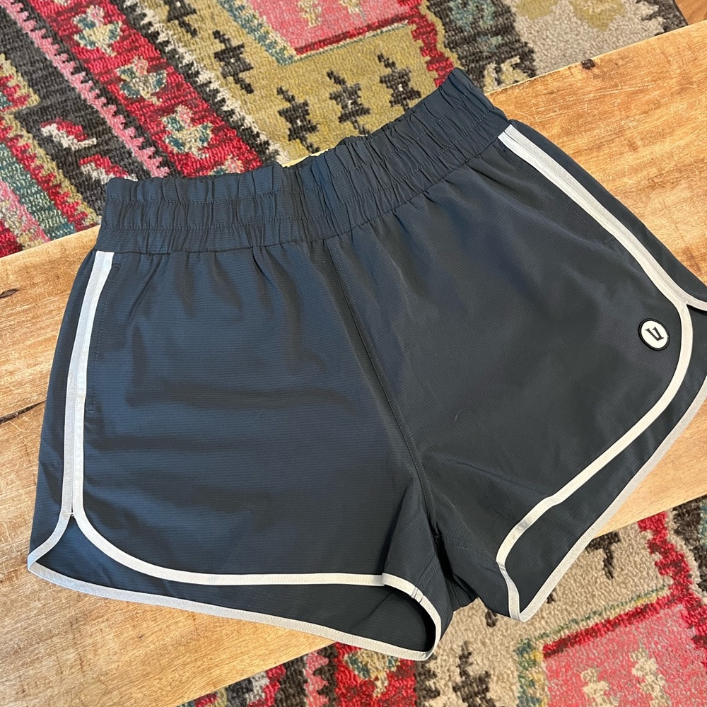Vuori gray  Athletic Shorts with White Trim size large woman’s